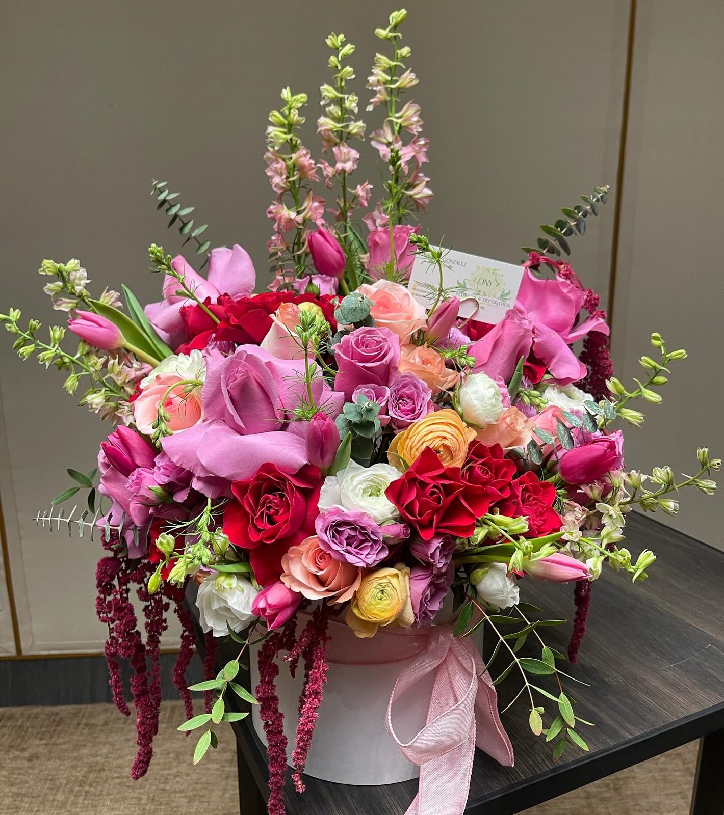 A lush bouquet of peonies and roses in a signature ONY box